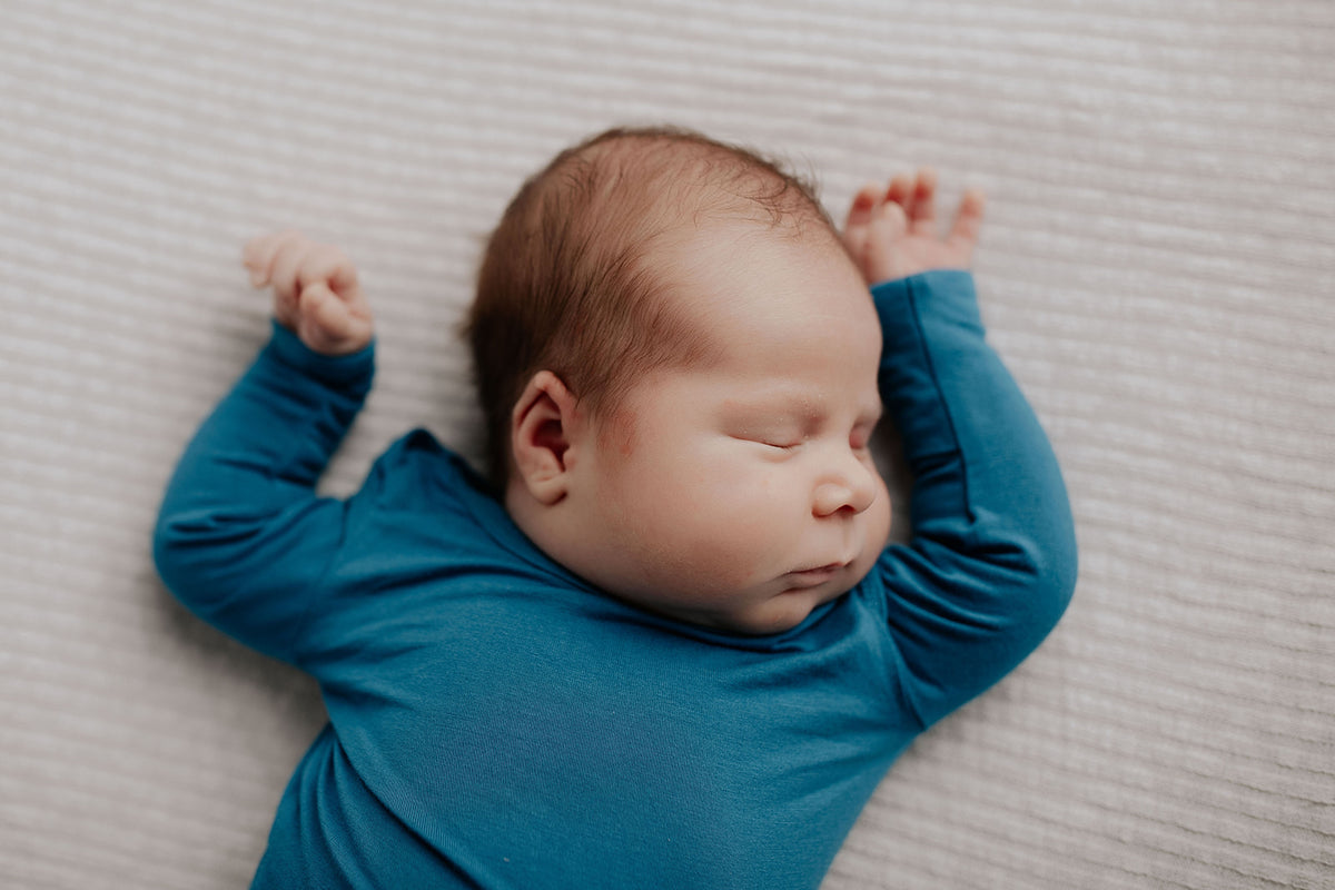 Newborn Jammies with buttery-soft fabric, fold-over mittens, footies for ultimate comfort and all-day coziness.