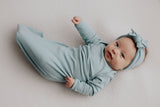 Capture precious moments with a newborn photoshoot featuring adorable knotted gowns for timeless photo ideas.