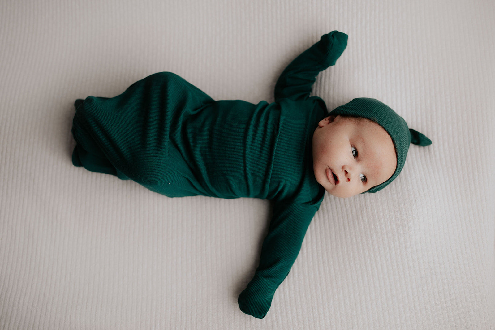 Ultra-soft baby gowns with tie bottoms for easy nighttime changes and pull-down tabs for effortless dressing.