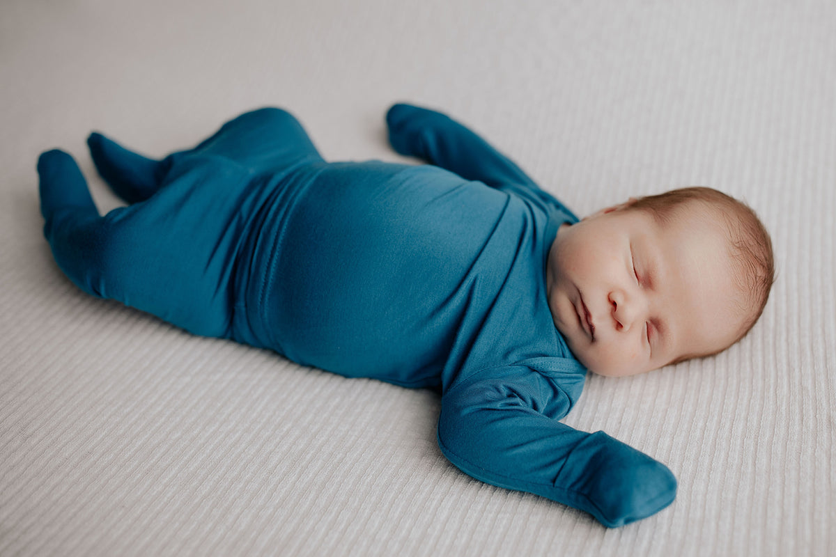 Newborn Jammies with buttery-soft fabric, fold-over mittens, footies for ultimate comfort and all-day coziness.