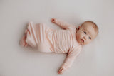 cute newborn photo of a baby in the Three Little Tots Knotted Baby Gown