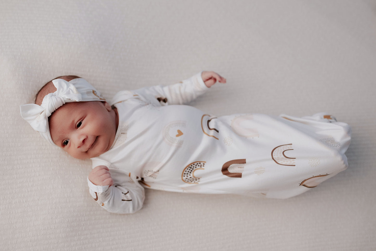 Luxuriously soft modal knotted baby gowns for rainbow babies, offering comfort, easy diaper changes, and style. Three Little Tots Rainbow Knotted Baby gown 