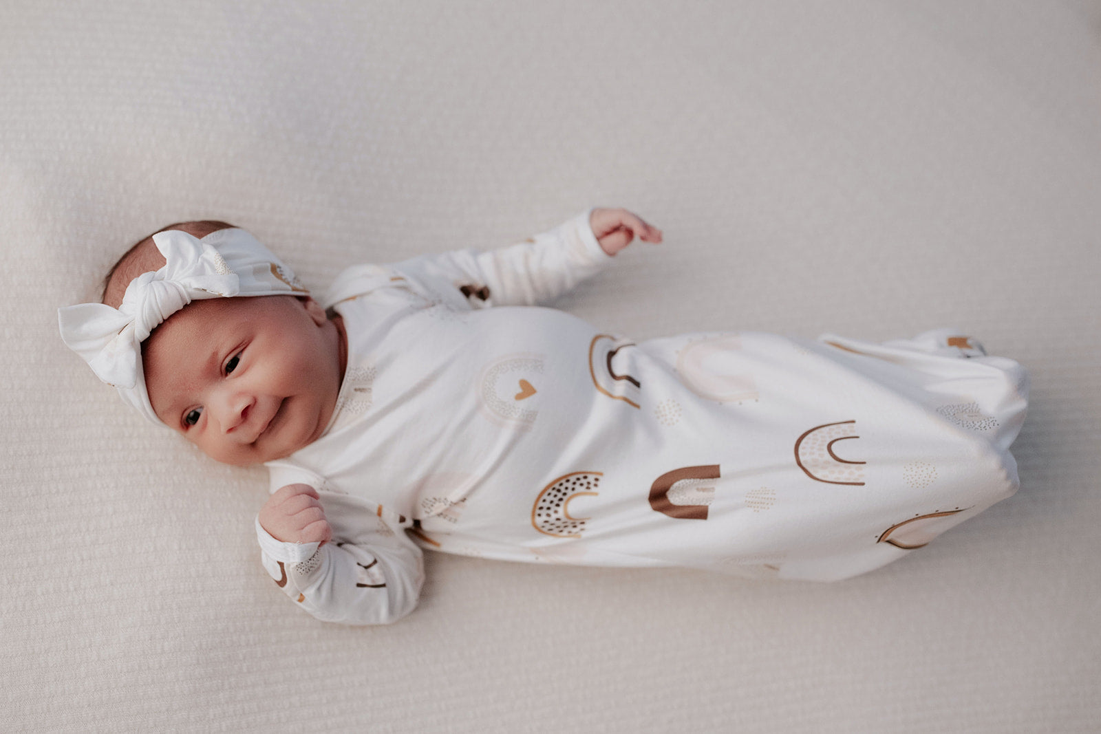 Luxuriously soft modal knotted baby gowns for rainbow babies, offering comfort, easy diaper changes, and style. Three Little Tots Rainbow Knotted Baby gown 