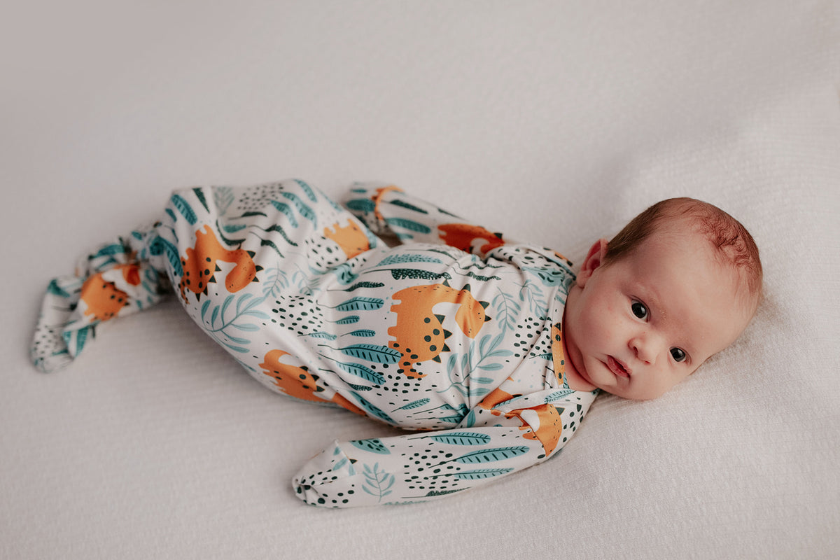 Ultra-soft Dinosaur baby gowns with stretchy fabric and tie bottom for easy night-time diaper changes.