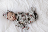 Comfort-focused baby gowns with soft, stretchy material and convenient pull-down tabs for quick dressing and changes.