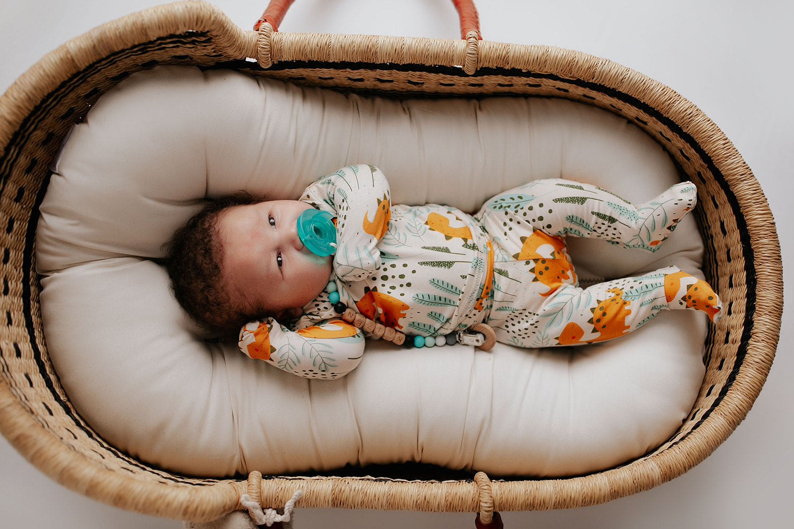Toddler and big kid jammies in matching prints and solids, designed for comfy bedtime or lounging all day. Snuggle Me Organic in a Plum and Sparrow Moses Basket
