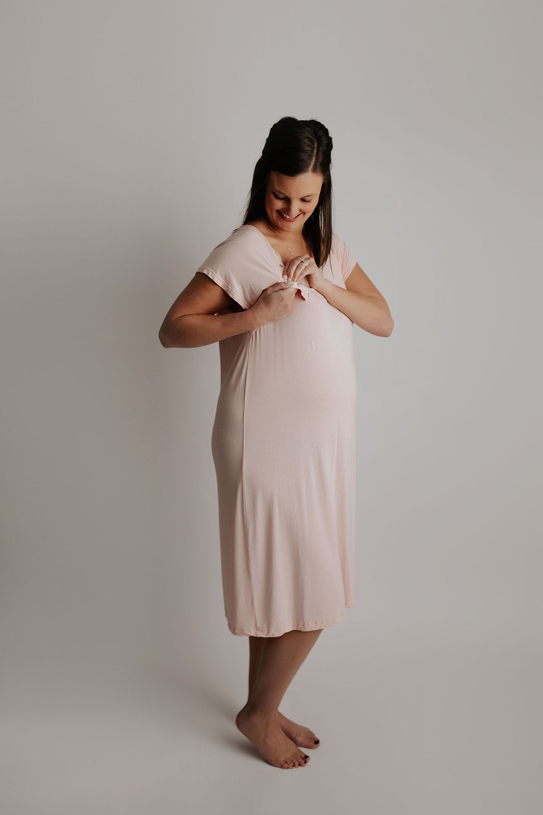The Three Little Tots Labor and delivery gown features snaps down the shoulders that allow for the gown to be put on and taken off over IVs. It also gives instant skin on skin access after birth and comfy breastfeeding late at night. 