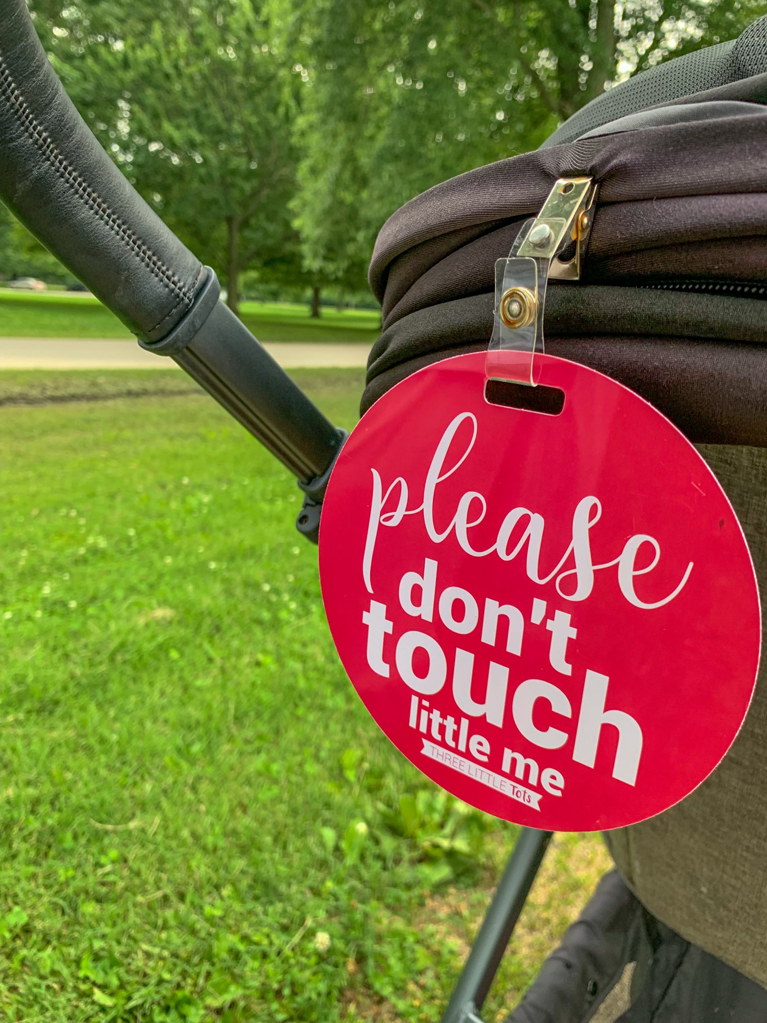 Three Little Tots Pink No Touching Sign on a stroller
