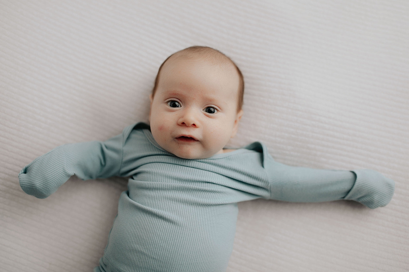 Newborn Jammies with buttery-soft fabric, fold-over mittens, footies for ultimate comfort and all-day coziness.