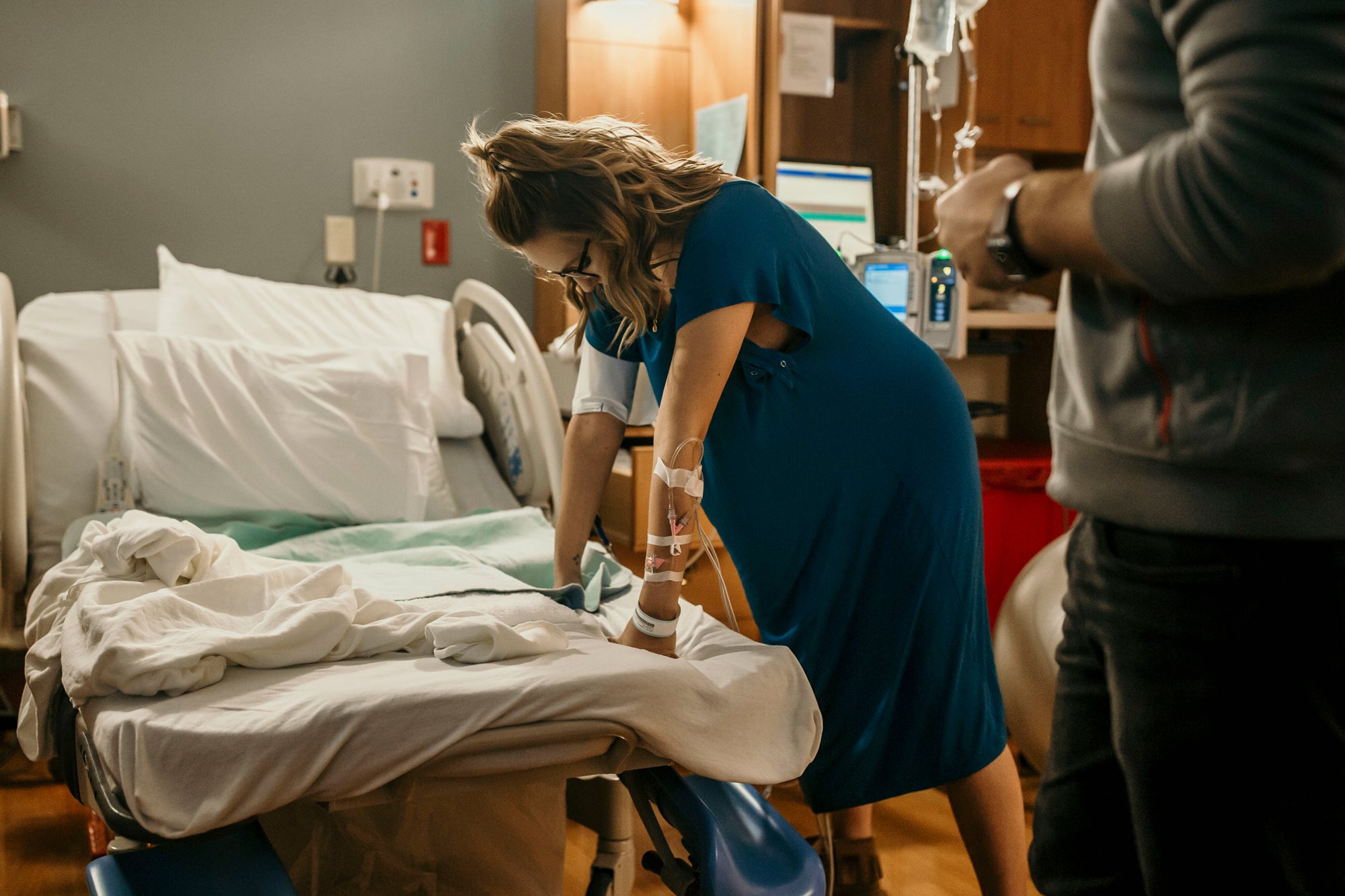 contractions during labor in a Three Little Tots Labor and Delivery Gown