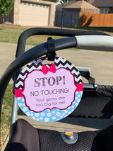 Three Little Tots Pink Zig Zag No Touching sign on a Chicco Newborn Car Seat